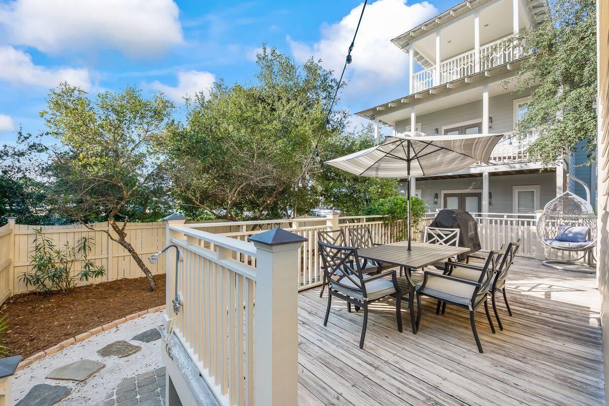 43 Sand Flea Drive Inlet Beach, FL 32461 - Photo 39 of 49 an outdoor space with furniture and umbrella