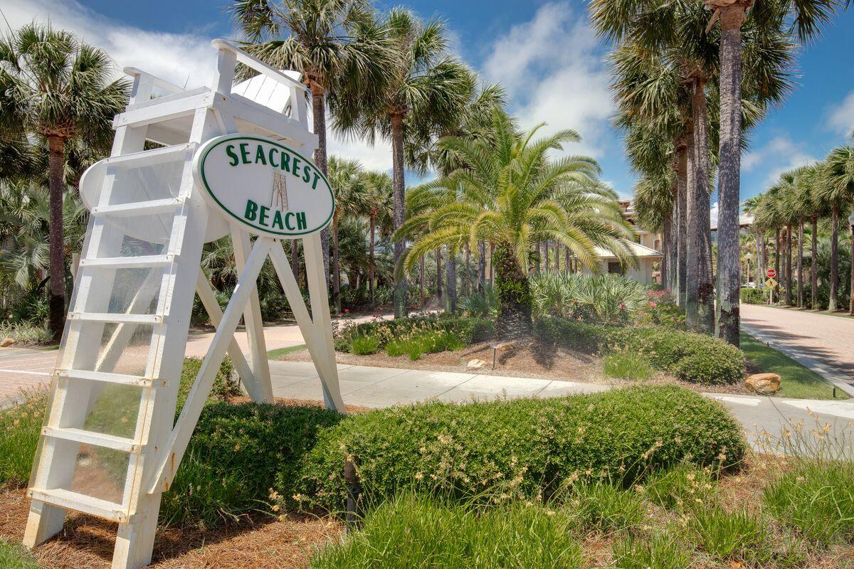 43 Sand Flea Drive Inlet Beach, FL 32461 - Photo 47 of 49 a front view of multi story residential apartment building with yard and sign board