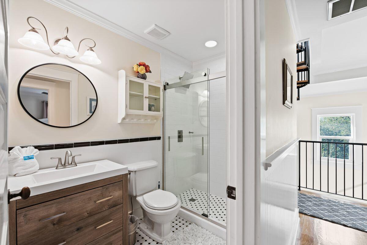 43 Sand Flea Drive Inlet Beach, FL 32461 - Photo 5 of 49 a bathroom with a sink a toilet and a mirror