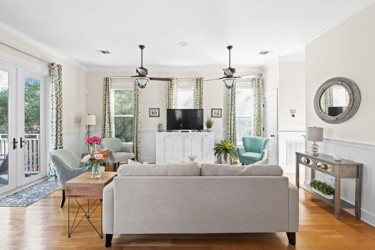 43 Sand Flea Drive Inlet Beach, FL 32461 - Photo 6 of 49 a living room with furniture a chandelier and a large window