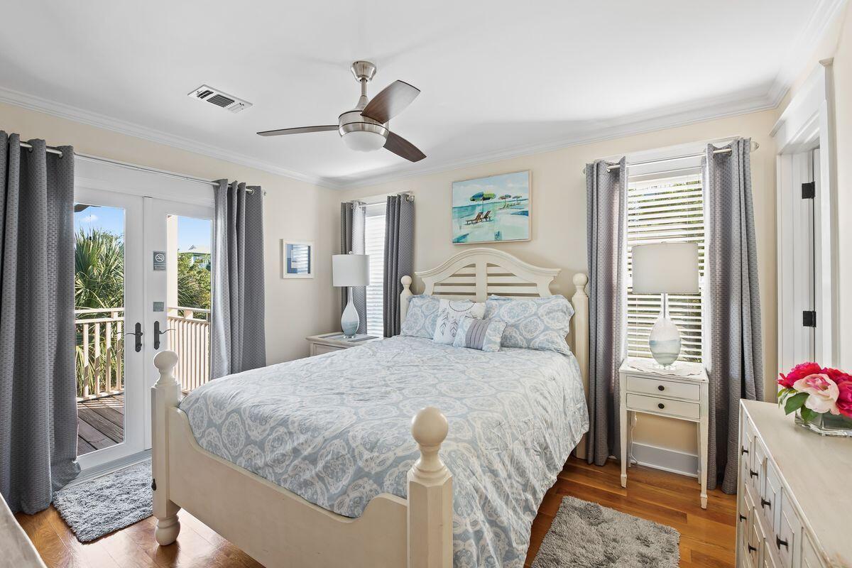 43 Sand Flea Drive Inlet Beach, FL 32461 - Photo 8 of 49 a bedroom with a bed and a chandelier