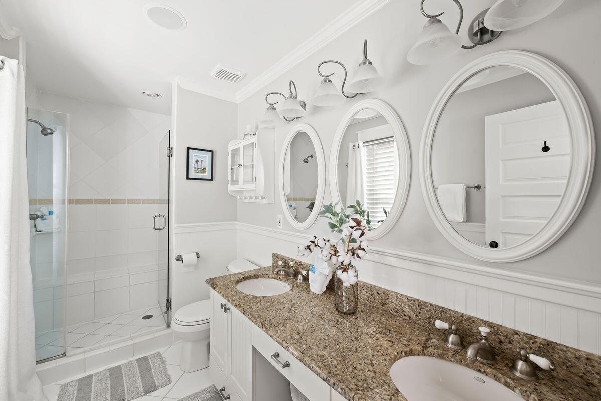 43 Sand Flea Drive Inlet Beach, FL 32461 - Photo 10 of 49 a bathroom with a granite countertop sink mirror and shower
