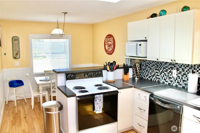 a kitchen with a stove and a sink
