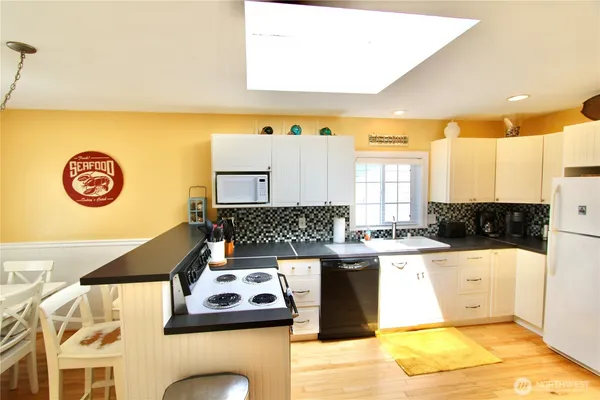a kitchen with a cabinets and appliances