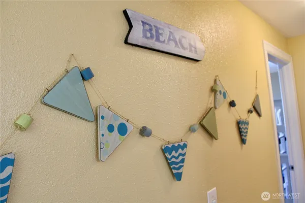 a view of a chair and table in the back yard of the house