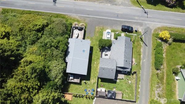 a view of a house with pool and wooden floor