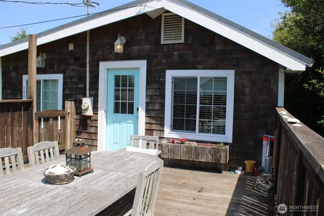 a front view of a house with sitting area