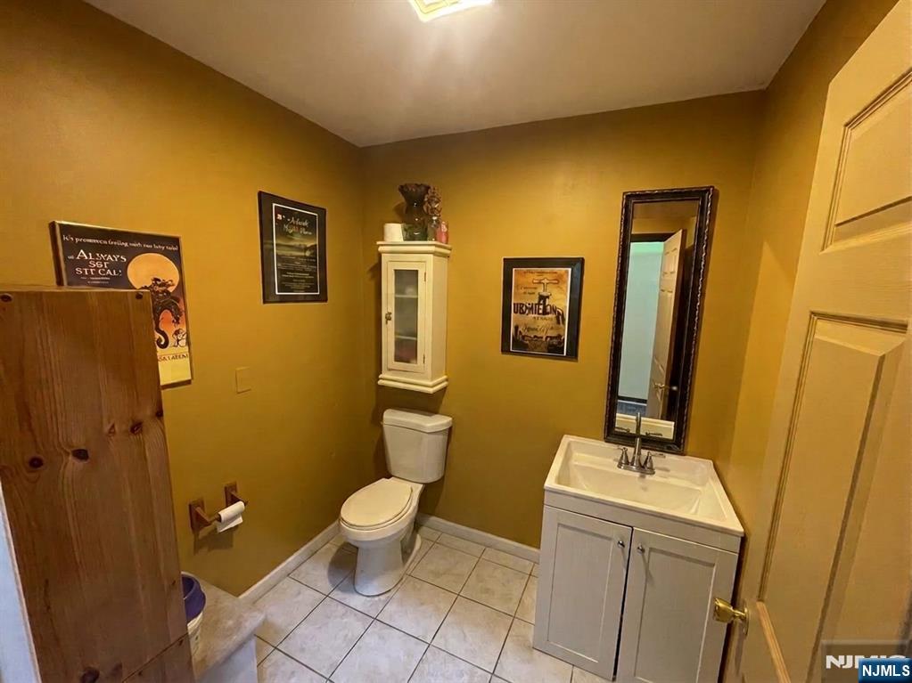 220 Bloomfield Avenue Montclair, NJ 07042 - Photo 6 of 13 a bathroom with sink toilet and mirror