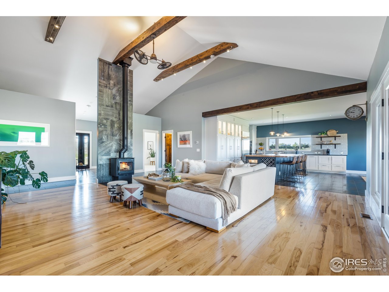 2139 County Road 15 Berthoud, CO 80513 - Photo 10 of 39 a living room with furniture and a wooden floor