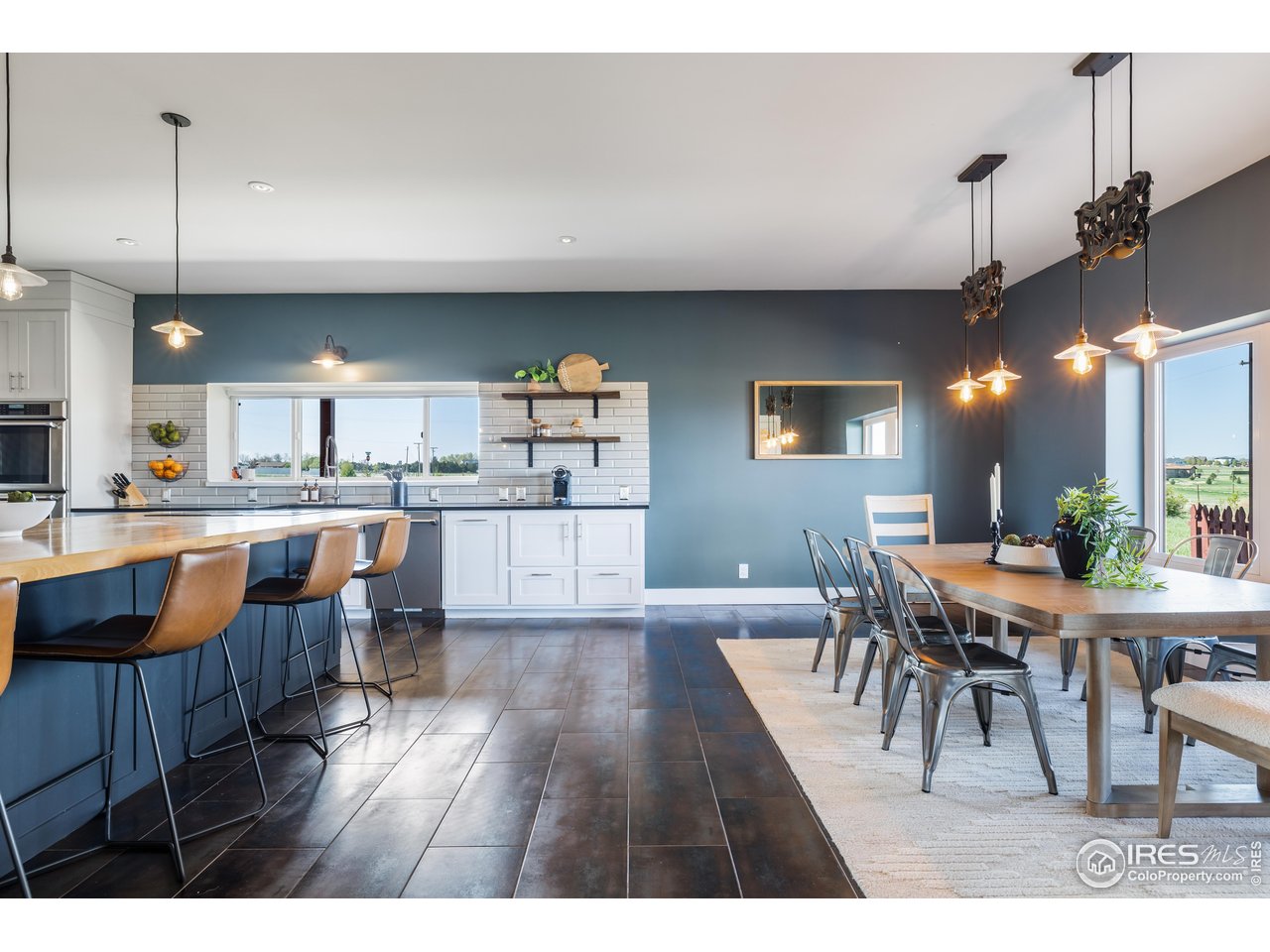 2139 County Road 15 Berthoud, CO 80513 - Photo 11 of 39 a dining room with furniture and wooden floor