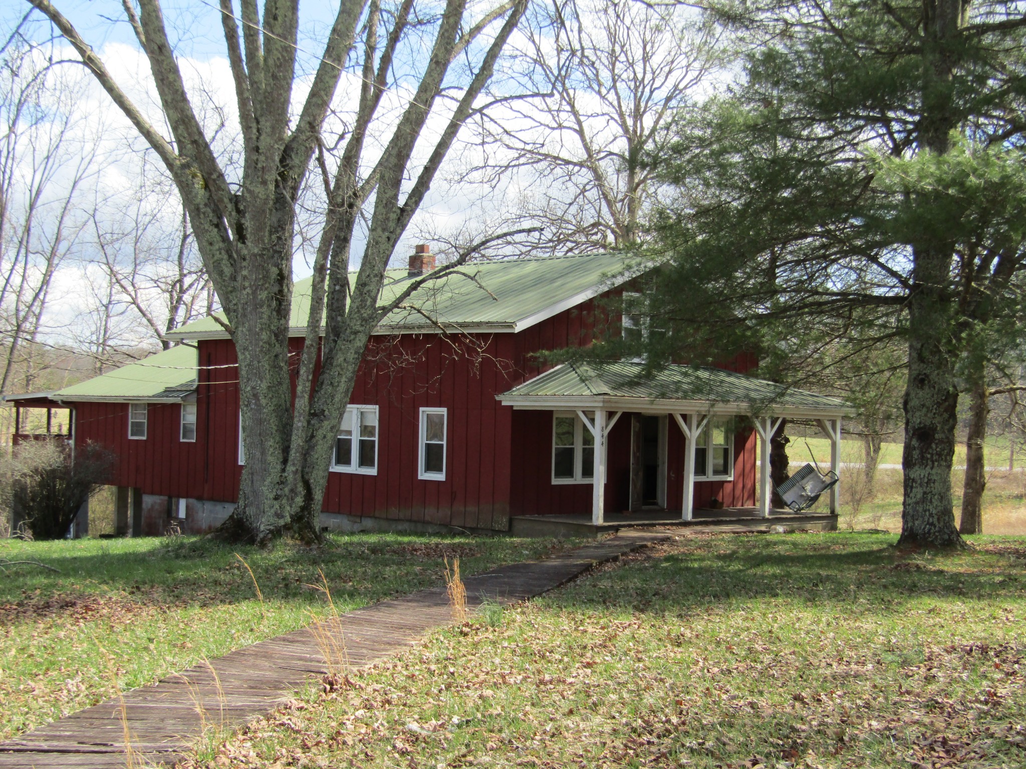 844 Brewstertown Road Robbins, TN 37852 - Photo 3 of 38 a front view of a house with a garden
