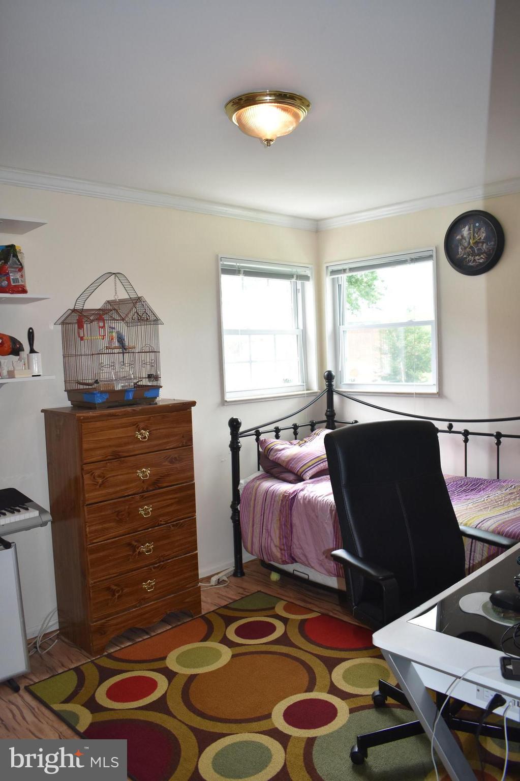 5810 Channing Road Springfield, VA 22150 - Photo 11 of 21 a living room with a bed and a window