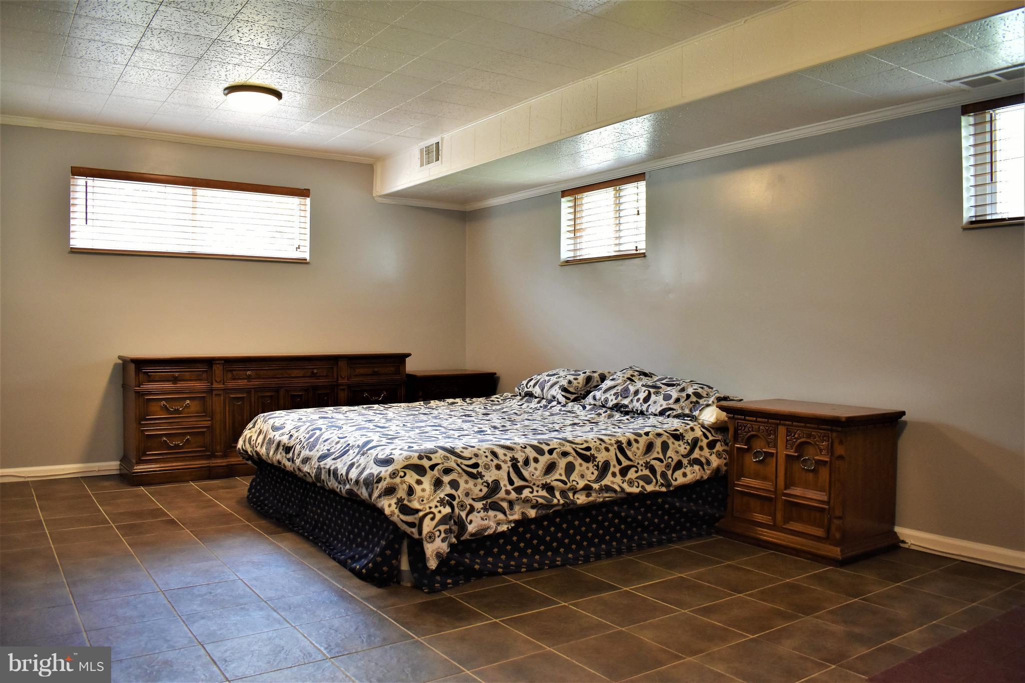 5810 Channing Road Springfield, VA 22150 - Photo 13 of 21 a bedroom with a bed and a window