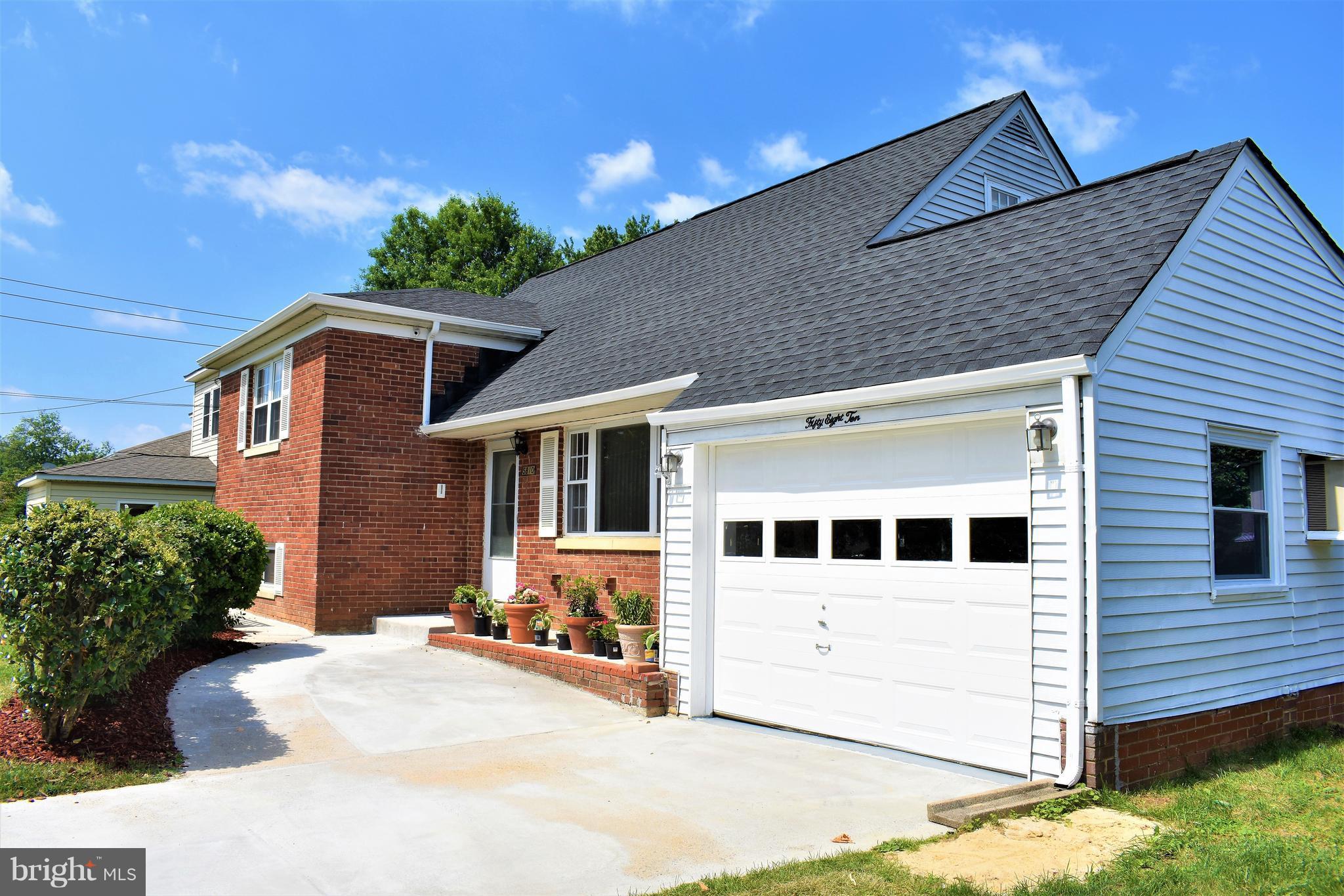 5810 Channing Road Springfield, VA 22150 - Photo 3 of 21 a front view of a house with a yard