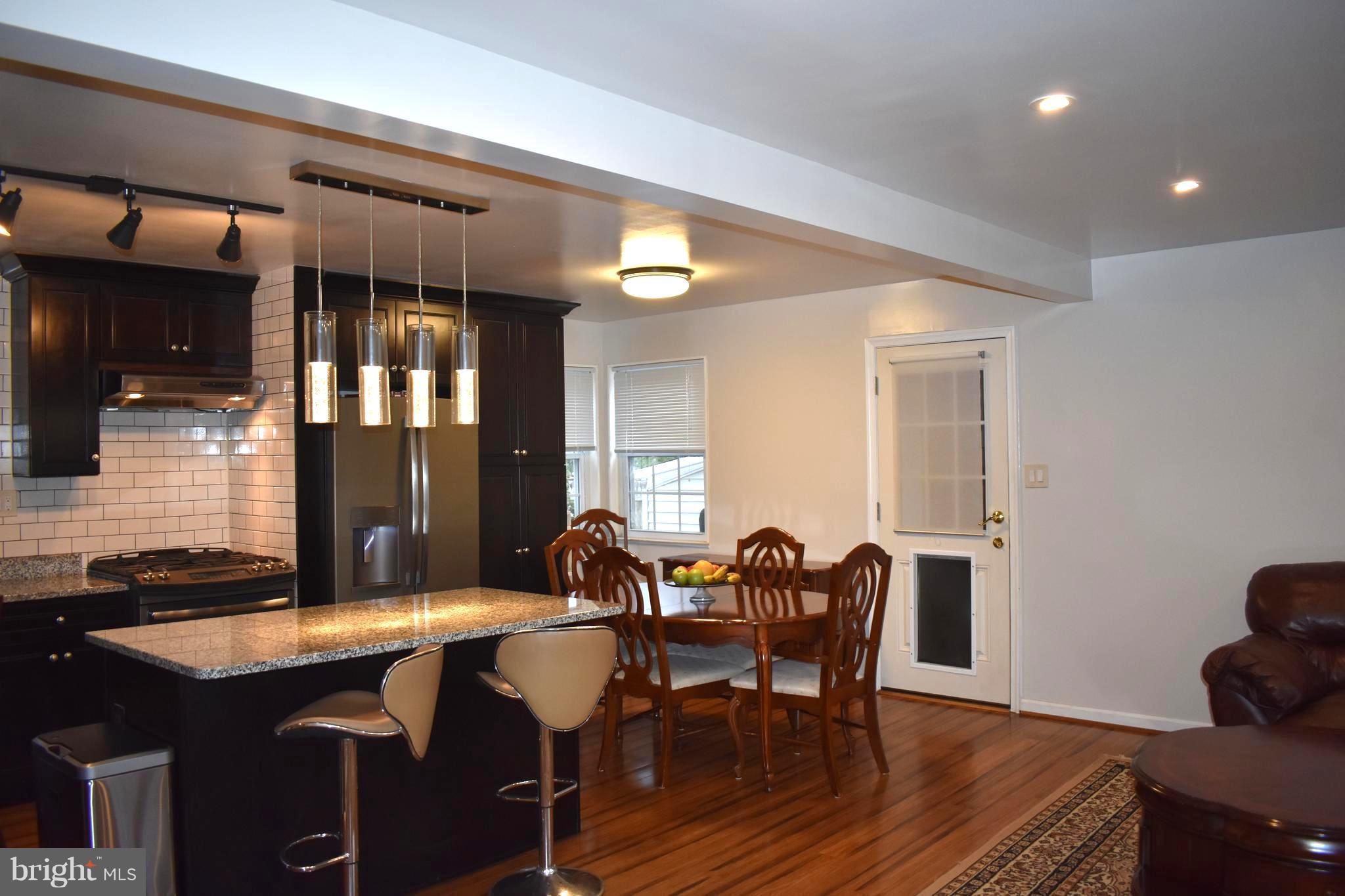 5810 Channing Road Springfield, VA 22150 - Photo 5 of 21 a view of a dining room with furniture and window