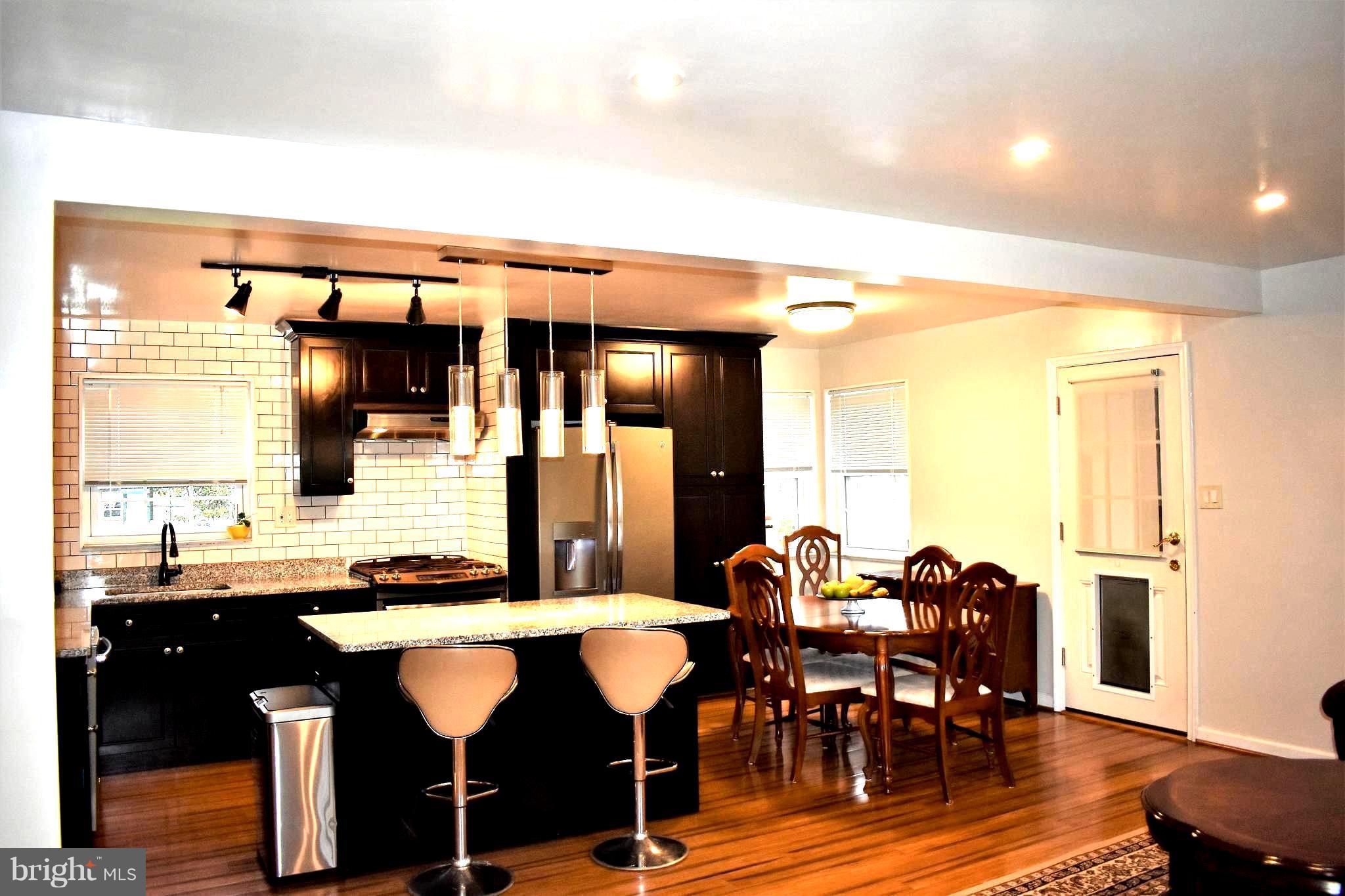 5810 Channing Road Springfield, VA 22150 - Photo 6 of 21 a view of a dining room with furniture and wooden floor