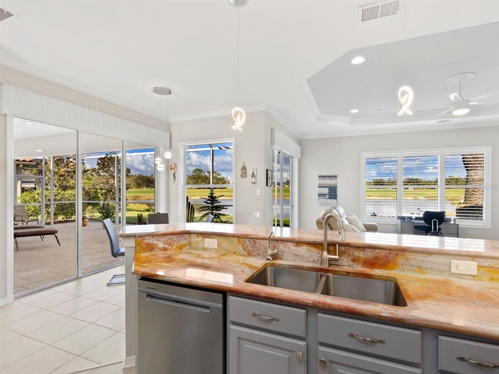 814 Adonis Place Venice, FL 34292 - Photo 19 of 38 a outdoor kitchen with a sink and large window