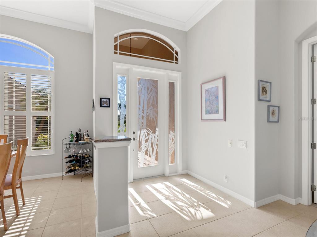 814 Adonis Place Venice, FL 34292 - Photo 3 of 38 a view of a livingroom with furniture and windows