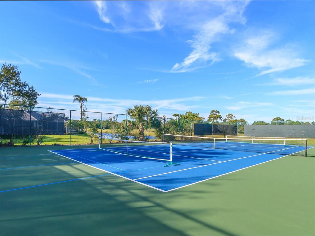 814 Adonis Place Venice, FL 34292 - Photo 34 of 38 a view of a tennis court