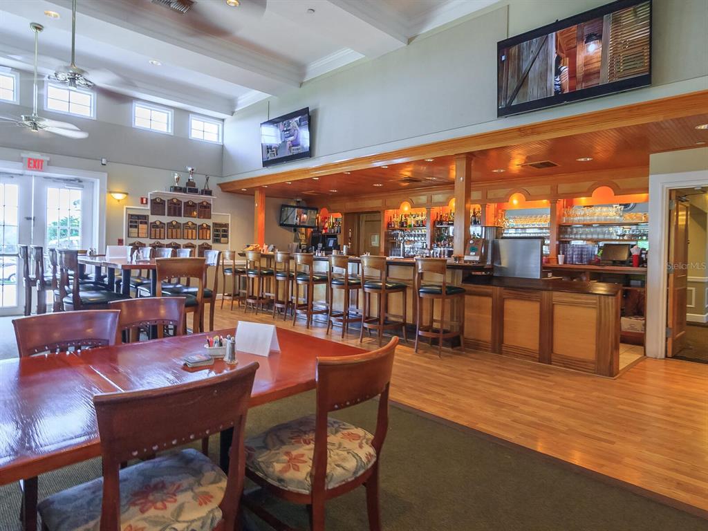814 Adonis Place Venice, FL 34292 - Photo 35 of 38 a view of a dining room with furniture