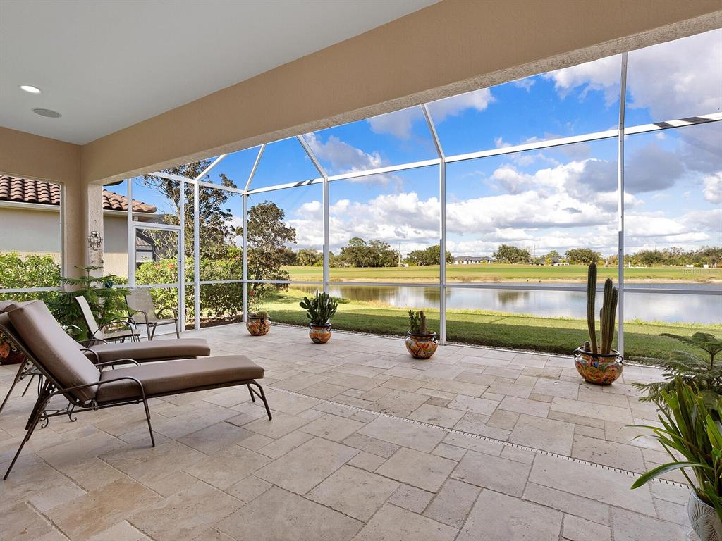 814 Adonis Place Venice, FL 34292 - Photo 6 of 38 a view of a swimming pool with a lounge chair