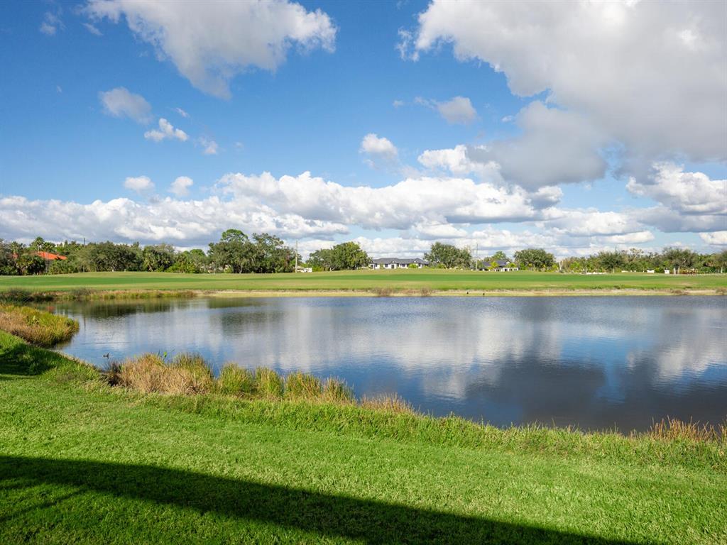 814 Adonis Place Venice, FL 34292 - Photo 7 of 38 a view of a lake with a city