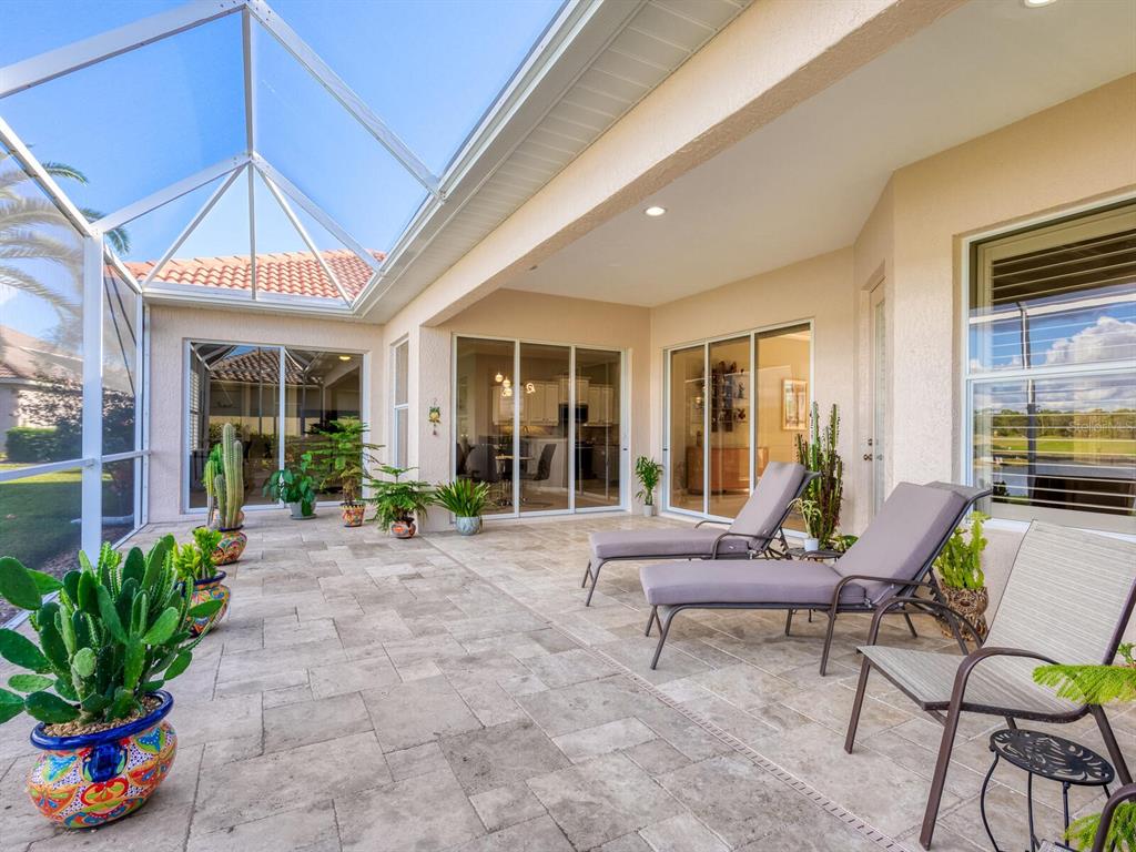814 Adonis Place Venice, FL 34292 - Photo 8 of 38 a living room filled with furniture and a potted plant