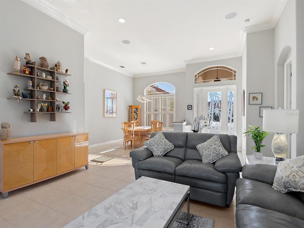 814 Adonis Place Venice, FL 34292 - Photo 10 of 38 a living room with furniture and a window
