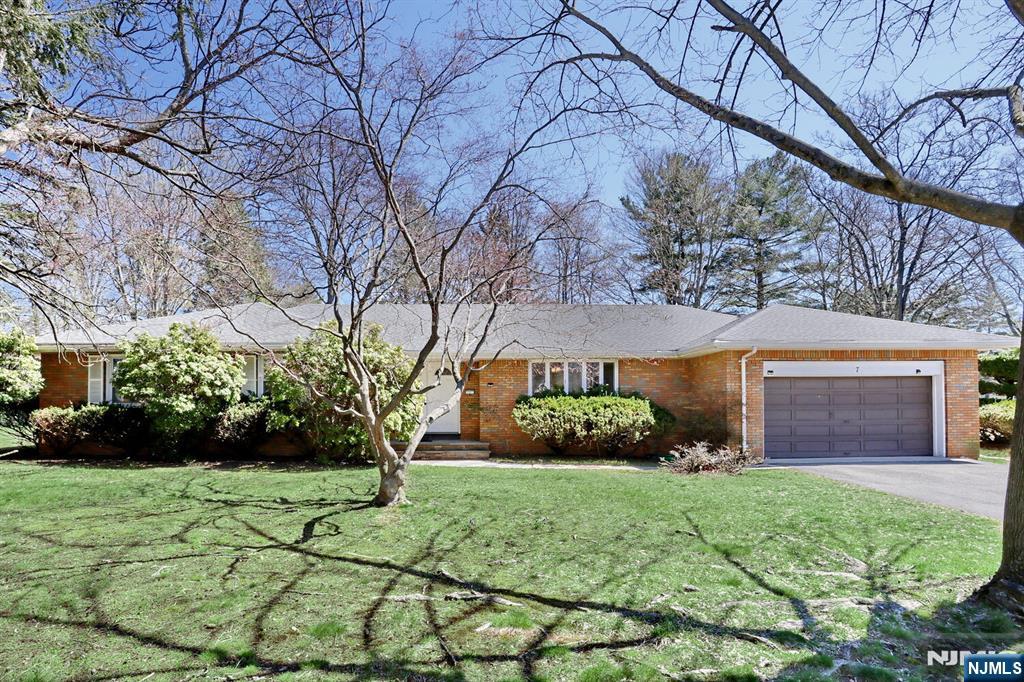 7 Tufts Court Paramus, NJ 07652 - Photo 1 of 50 a front view of a house with garden