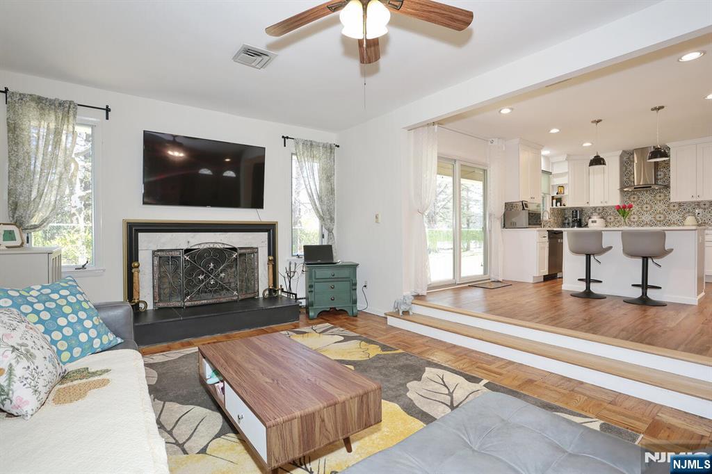 7 Tufts Court Paramus, NJ 07652 - Photo 12 of 50 a living room with furniture and a fireplace