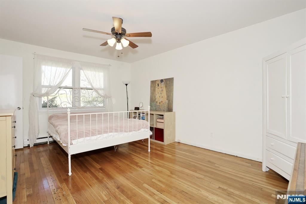7 Tufts Court Paramus, NJ 07652 - Photo 18 of 50 a bedroom with a bed and a window