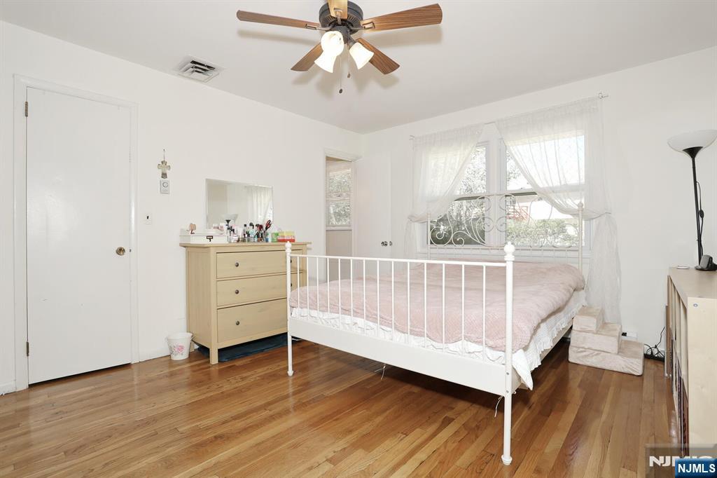 7 Tufts Court Paramus, NJ 07652 - Photo 19 of 50 a bedroom with a bed and a window