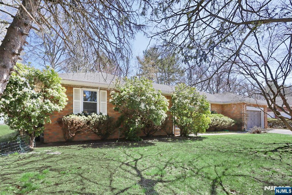 7 Tufts Court Paramus, NJ 07652 - Photo 2 of 50 a front view of a house with garden
