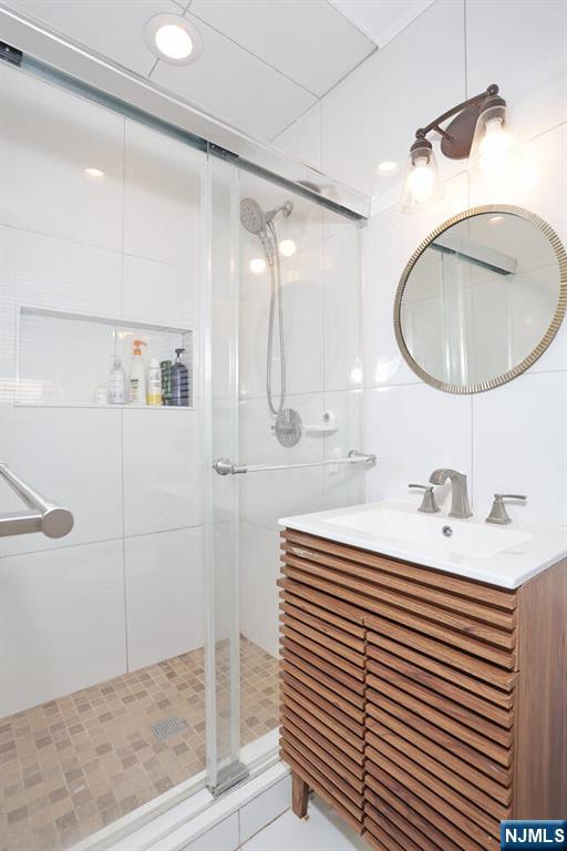 7 Tufts Court Paramus, NJ 07652 - Photo 21 of 50 a bathroom with a sink a toilet and shower