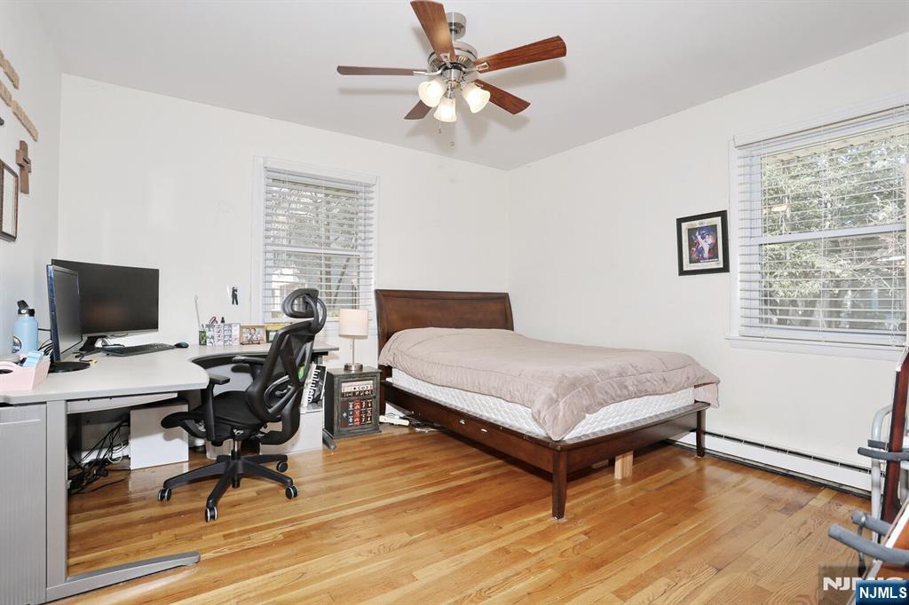 7 Tufts Court Paramus, NJ 07652 - Photo 22 of 50 a bedroom with a bed and a desk