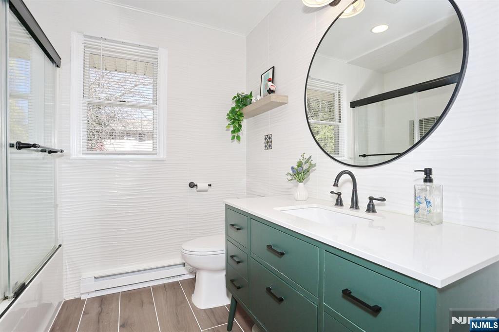 7 Tufts Court Paramus, NJ 07652 - Photo 25 of 50 a bathroom with a sink and a mirror