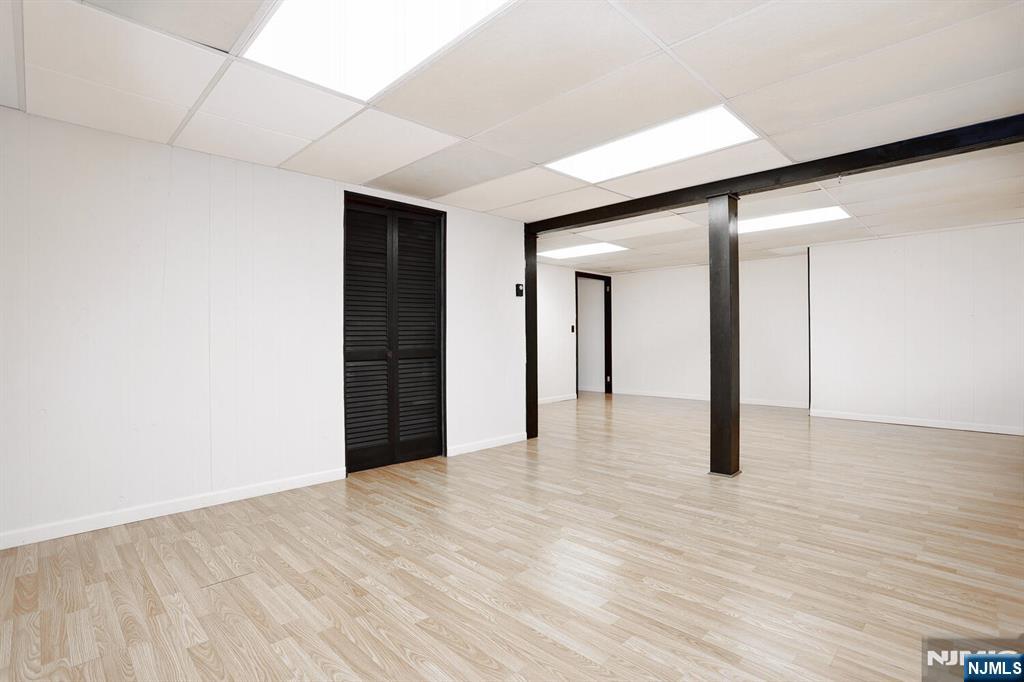 7 Tufts Court Paramus, NJ 07652 - Photo 36 of 50 a view of an empty room with wooden floor