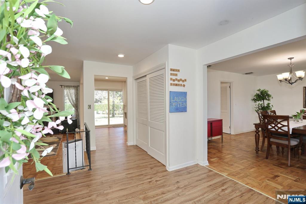 7 Tufts Court Paramus, NJ 07652 - Photo 4 of 50 a dining room with furniture potted plants and wooden floor