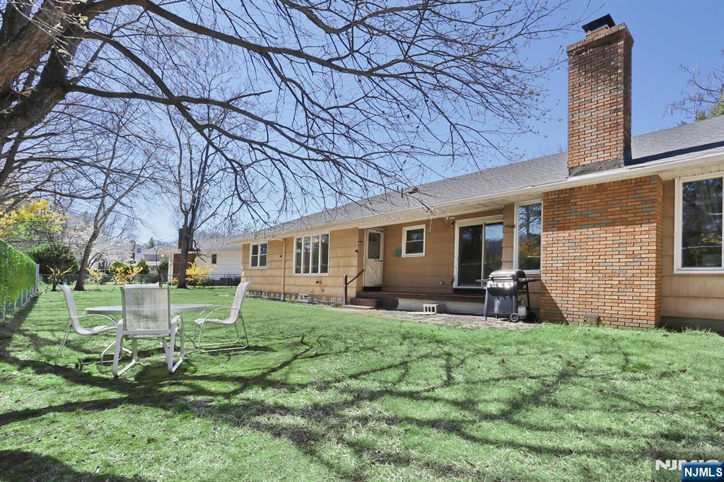 7 Tufts Court Paramus, NJ 07652 - Photo 44 of 50 a view of a house with a yard porch and sitting area