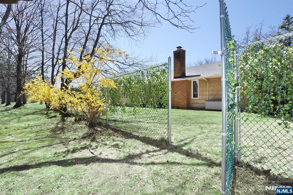7 Tufts Court Paramus, NJ 07652 - Photo 45 of 50 a front view of a house with garden