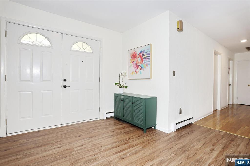 7 Tufts Court Paramus, NJ 07652 - Photo 5 of 50 a view of a hallway with wooden floor