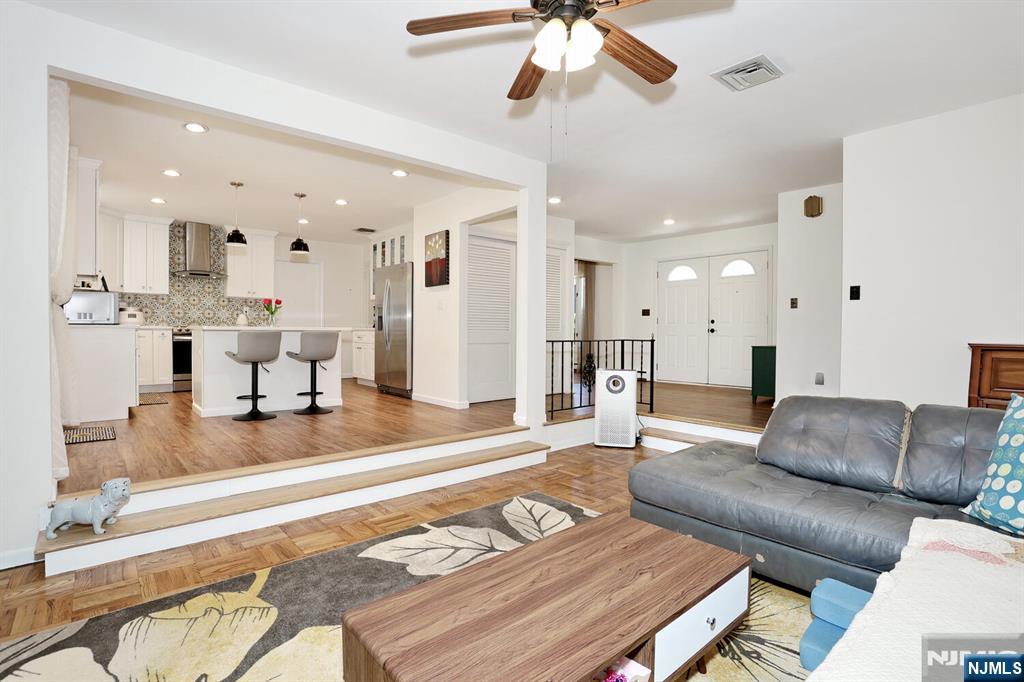 7 Tufts Court Paramus, NJ 07652 - Photo 10 of 50 a living room with furniture and a dining table