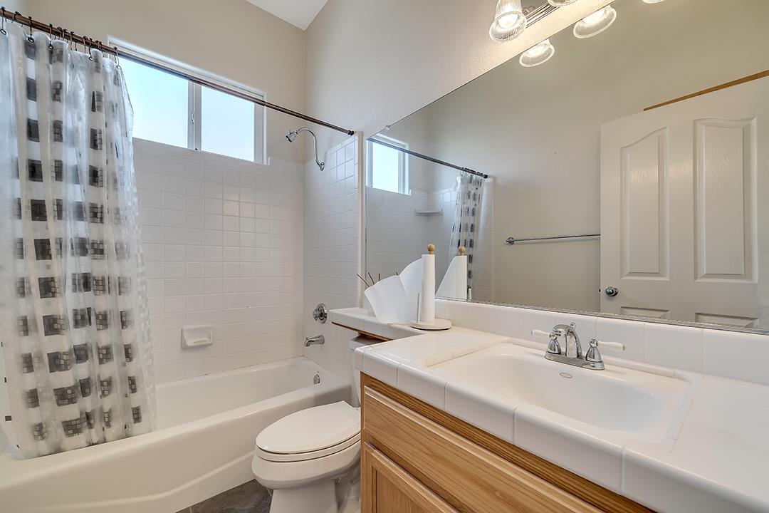 916 East Milgeo Avenue Ripon, CA 95366 - Photo 8 of 36 a bathroom with a sink a toilet and shower