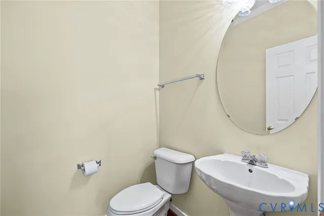 a spacious bathroom with a double vanity sink a mirror and a