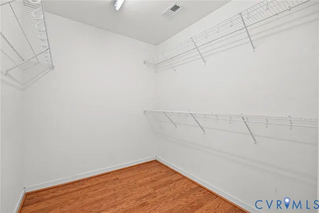 a view of entryway with wooden floor and stairs