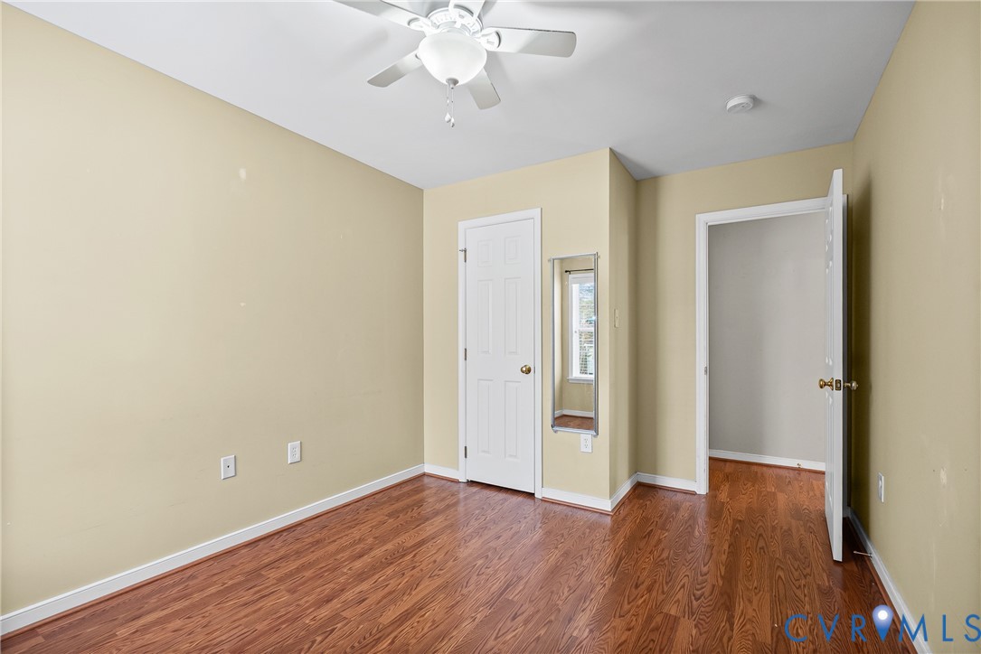 116 Jesse's Way Farmville, VA 23901 - Photo 31 of 47 an empty room with wooden floor and chandelier fan