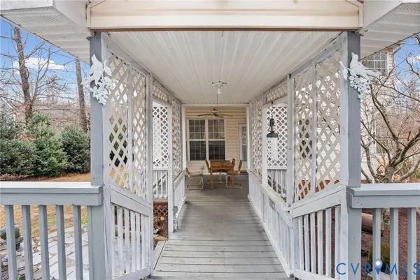 a view of a porch with wooden floor