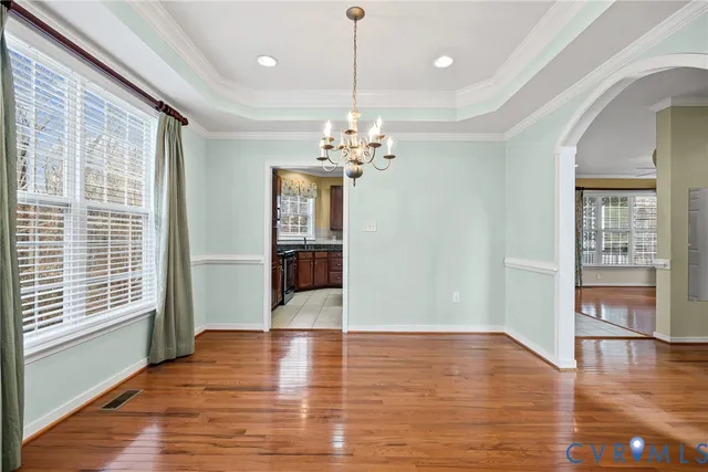 a kitchen with stainless steel appliances granite countertop wooden cabinets a stove top oven a sink and dishwasher