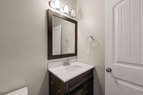an empty room with closet and a ceiling fan