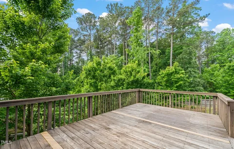 a view of balcony with wooden floor